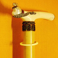 Amber walking stick with Ivory Handle Fitted with Basra Pearl shaped as a lady inlaid with Rubies, Emerals and Diamonds
